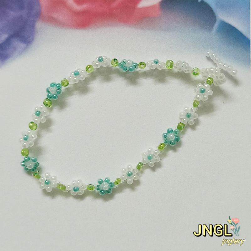 Vòng tay hạt cườm gạo kết hoa màu tím mã TK501