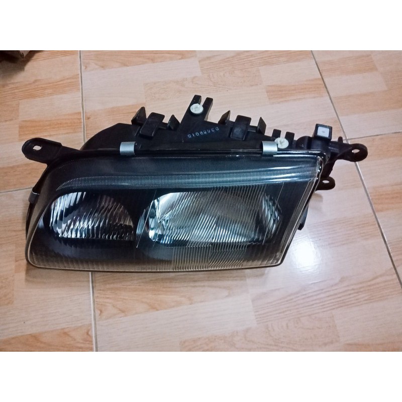 Đèn pha Mazda 626 đời 1997-2000 -tặng vòng xoay hương hoa