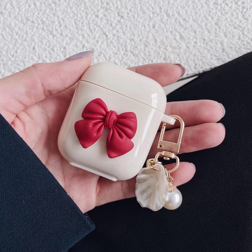 Vỏ Bảo Vệ Hộp Sạc Tai Nghe Bluetooth Apple Airpods 1 / 2 Pro Bằng Tpu Chống Thất Lạc Hình Nơ Màu Trắng