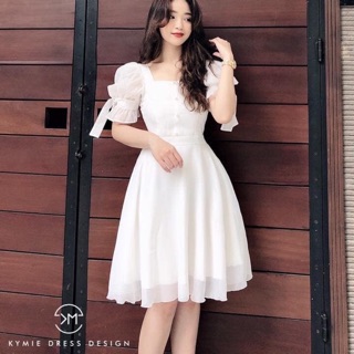 Váy xoè cổ vuông tay bồng buộc nơ