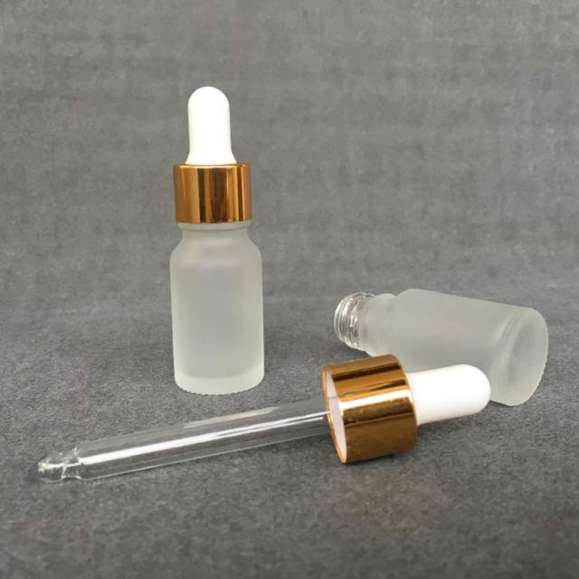 100 chai tinh dầu 10ml xi mờ ( bóp trắng khoen vàng )