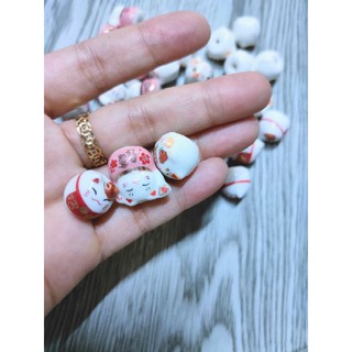 Qt mèo gốm thần tài 2x1,5cm