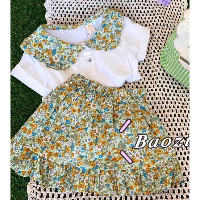 Bộ bé gái trắng cổ sen tròn hoa và chân váy đuôi cá hoa nhí liền quần XHN881