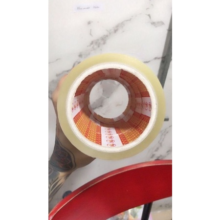 Băng keo trong dán hàng loại 1, keo dày, lõi giấy mỏng dễ bể vỡ màu đen