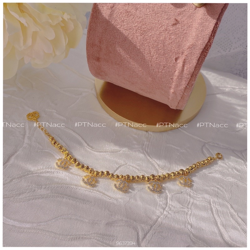 Lắc tay bi xi 2 màu trắng, vàng charm logo X, lắc bi charm thương hiệu sang trọng .PTNACC.