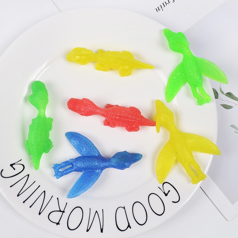 Khủng long đeo tay bắn dính tường Đồ Chơi Ná Dính Tường Hình Gà Tây Chiên Vui Nhộn