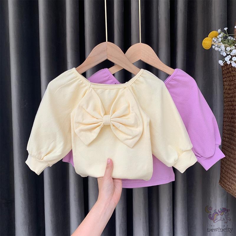 Áo dài tay phối nơ phong cách đáng yêu dành cho bé gái