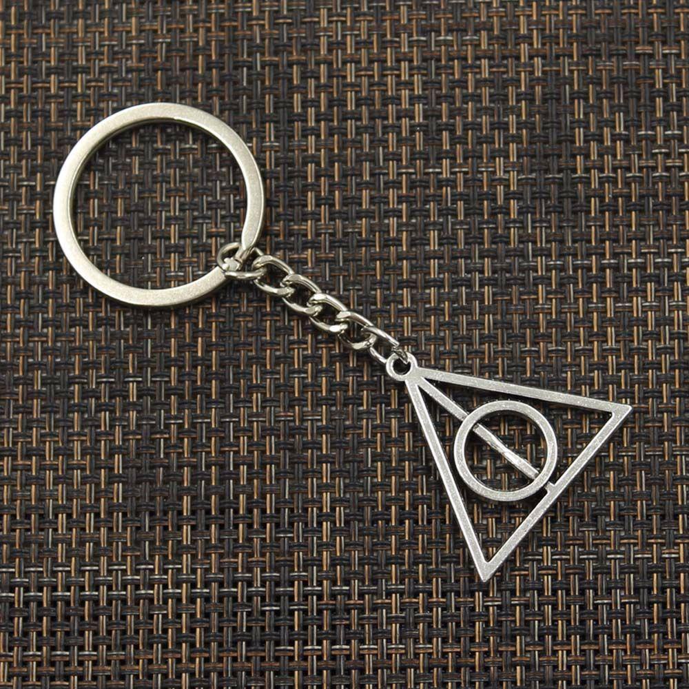 Móc Khóa Tròn Họa Tiết Deathly Hallows Thời Trang Giá Đỡ