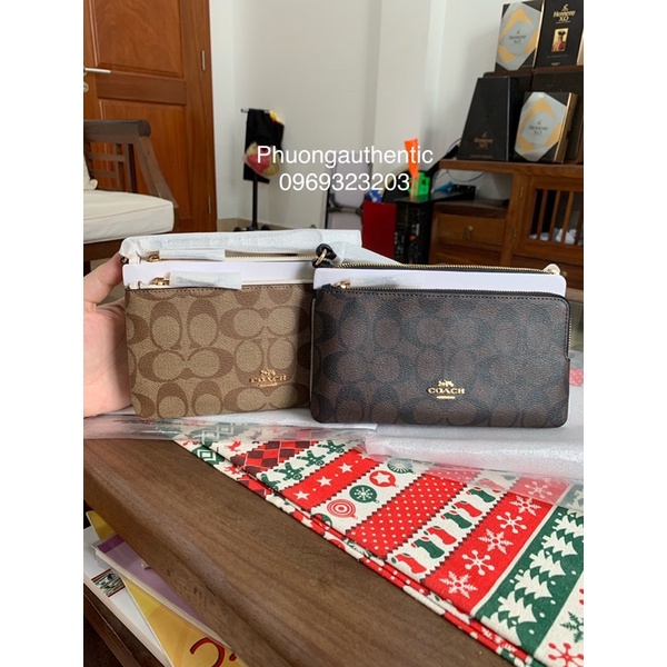 Ví cầm tay Coach logo signature canvas AUTHENTIC