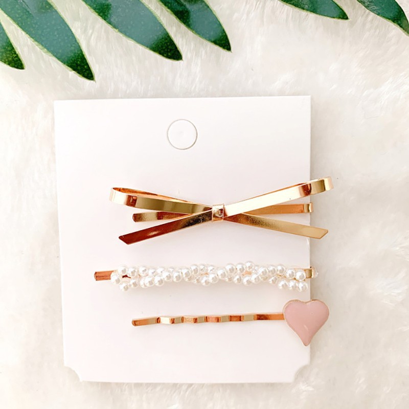 Kẹp tóc hình trái tim và ngọc trai