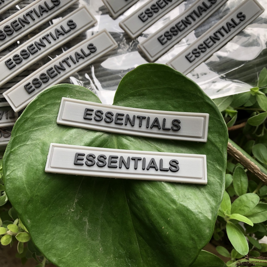Nhận sản xuất tem mác cao su ESSENTIALS thương hiệu theo yêu cầu giá rẻ.