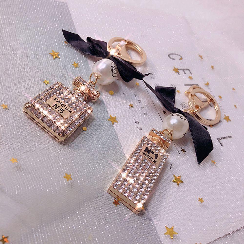 Móc Khóa Hình Chai Nước Hoa Họa Tiết Chấm Bi Lấp Lánh Dễ Thương