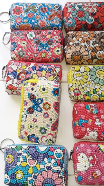 Một cái ví_bóp da Pu mini đa năng có dây kéo kích thước 10x6x3 cm rất đẹp