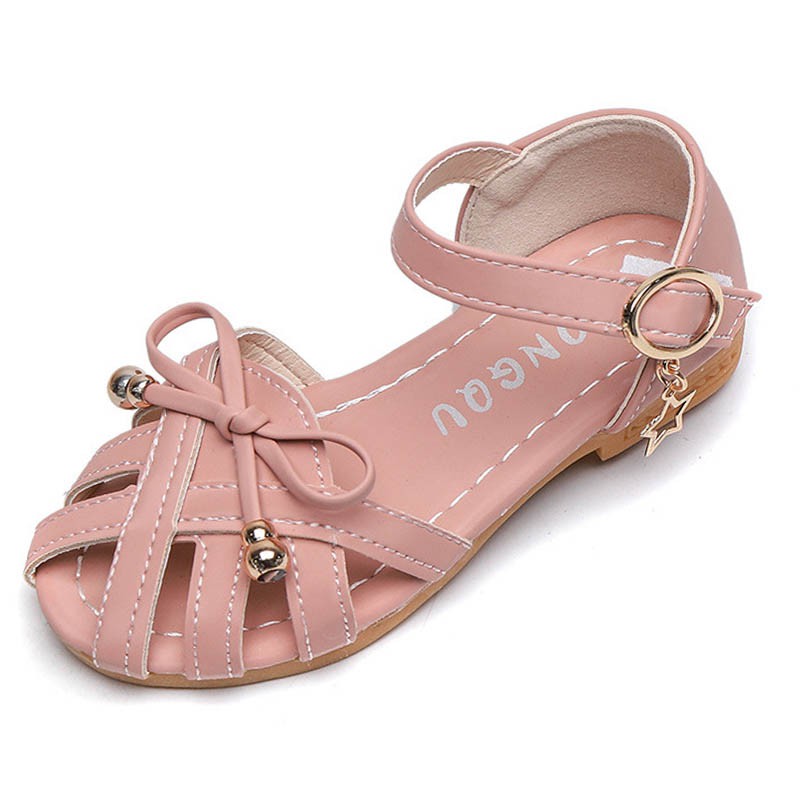 Giày sandal đế bằng thắt nơ màu hồng có lỗ phong cách chiến binh dành cho bé gái 2-12 tuổi đi biển