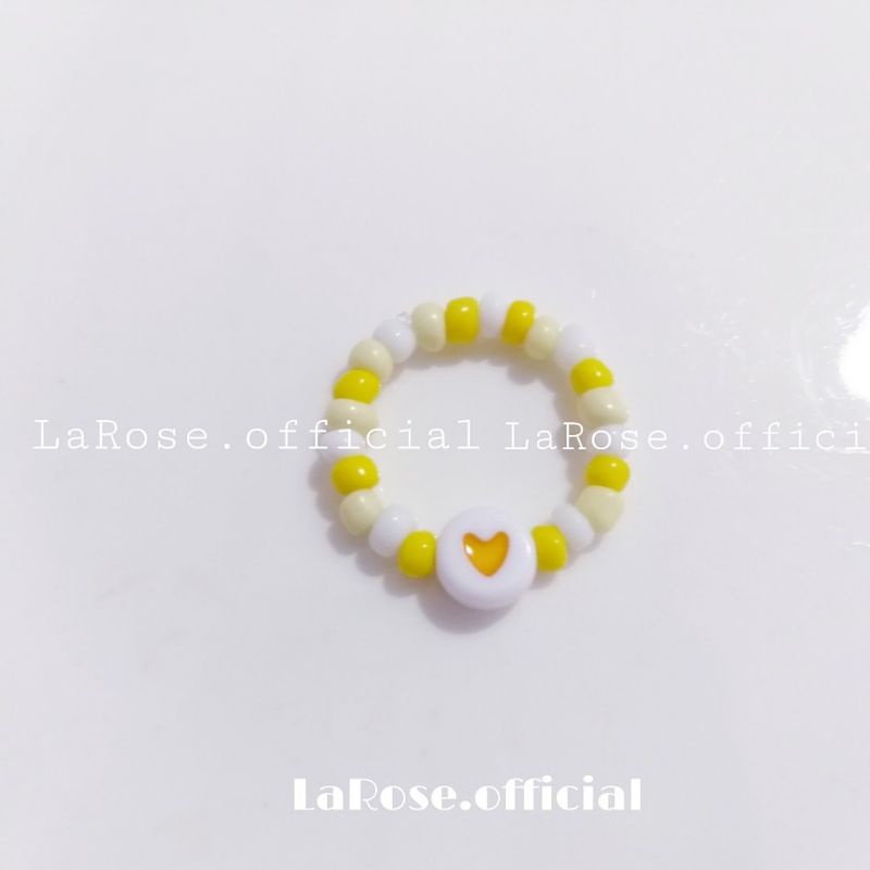 Nhẫn hạt cườm mix charm tim
