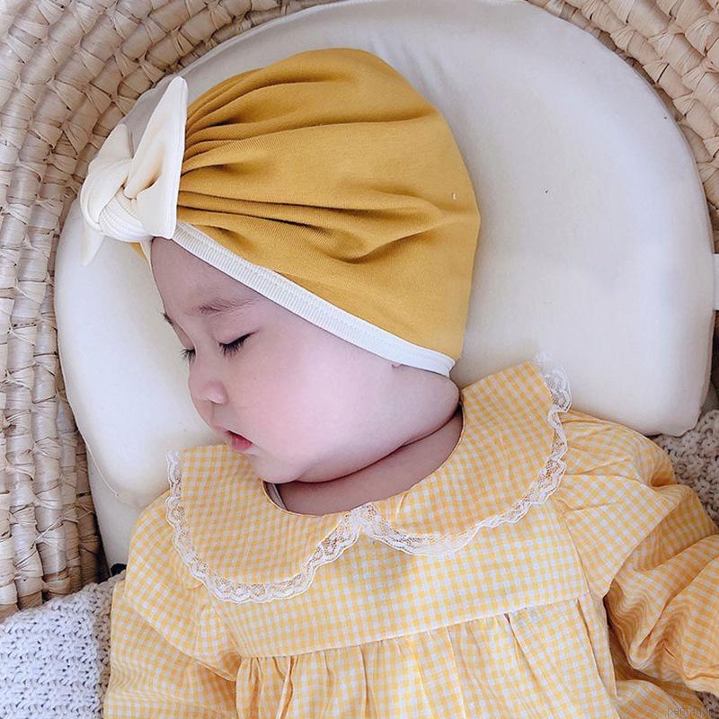 Mũ trùm đầu beanie đính nơ màu trơn đáng yêu dành cho trẻ em