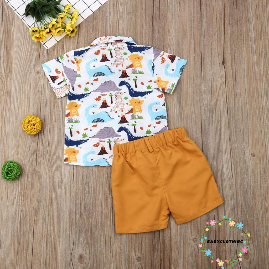 Set trang phục bé trai 2 món gồm áo sơ mi tay ngắn họa tiết khủng long và quần short thời trang