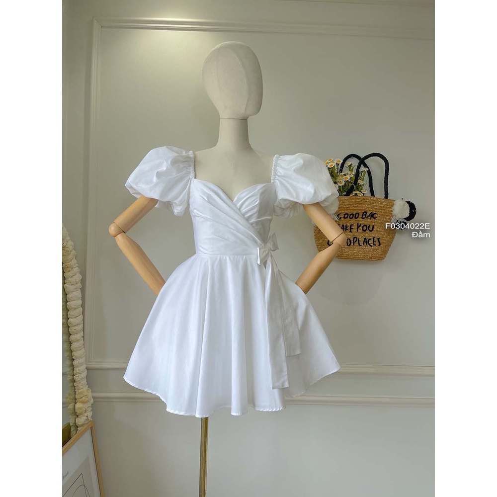 Đầm xòe thô thắt nơ bên eo ngực đắp chéo tay bồng