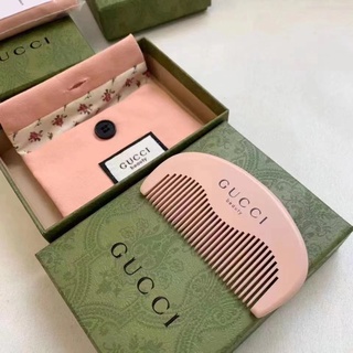 Lược chải tóc xoăn lông heo gucci bằng gốm sứ hình hoa lớn