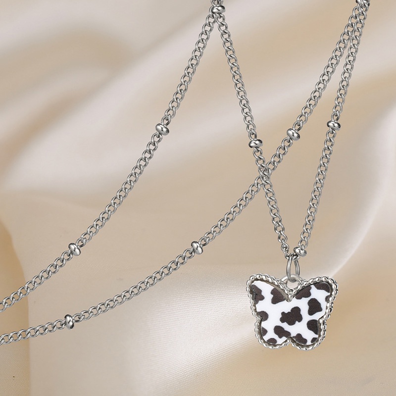 1 Vòng Cổ Choker Màu Trắng / Đen Phối Mặt Hình Bướm / Bò Sữa / Hình Học Thời Trang Cho Nữ