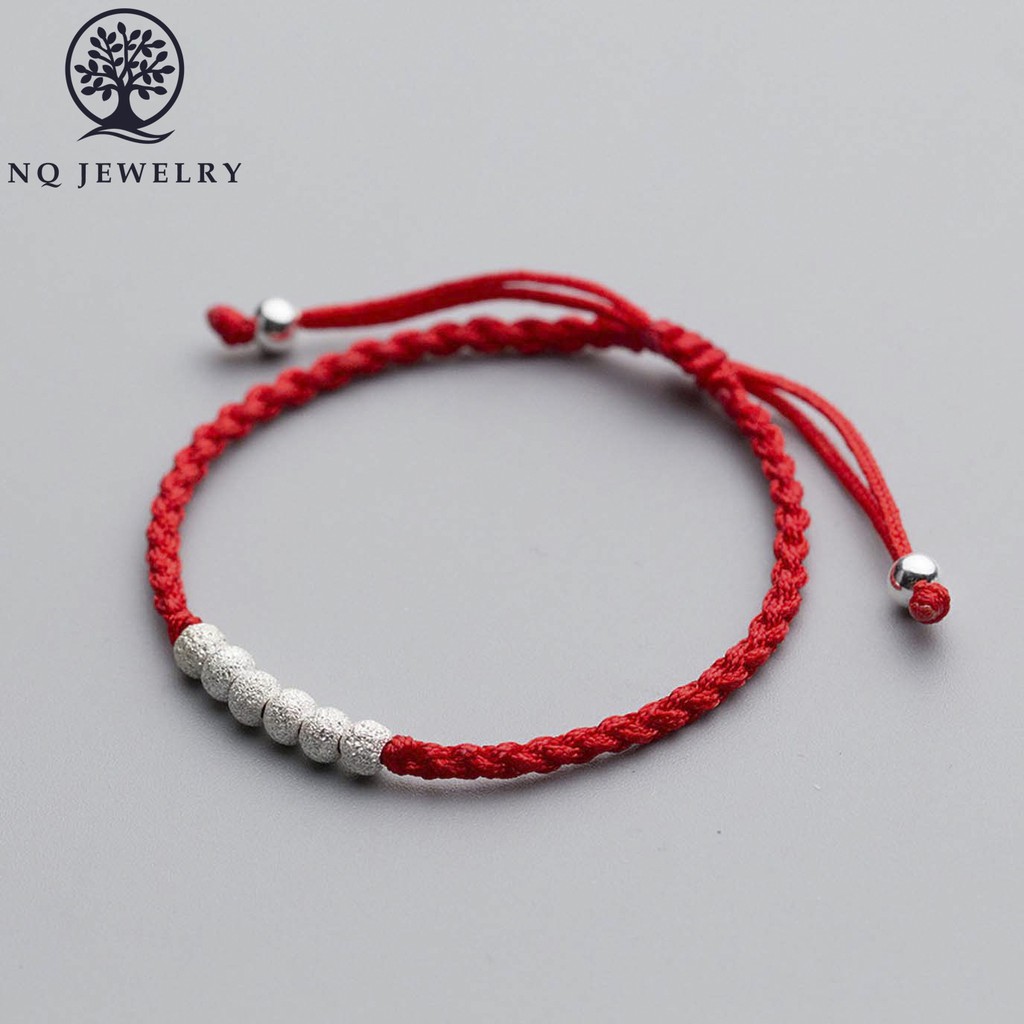 Vòng thắt dây đỏ bi cát - NQ Jewelry