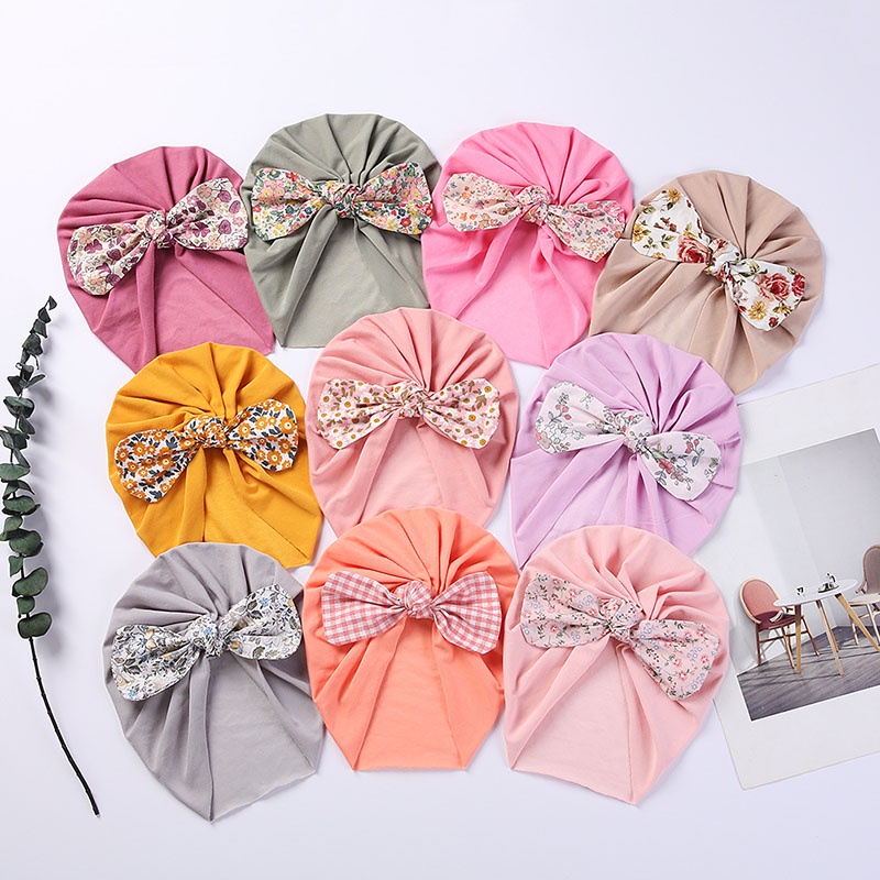 Mũ trùm đầu vải cotton mềm phối nơ in hoa cho bé trai và bé gái