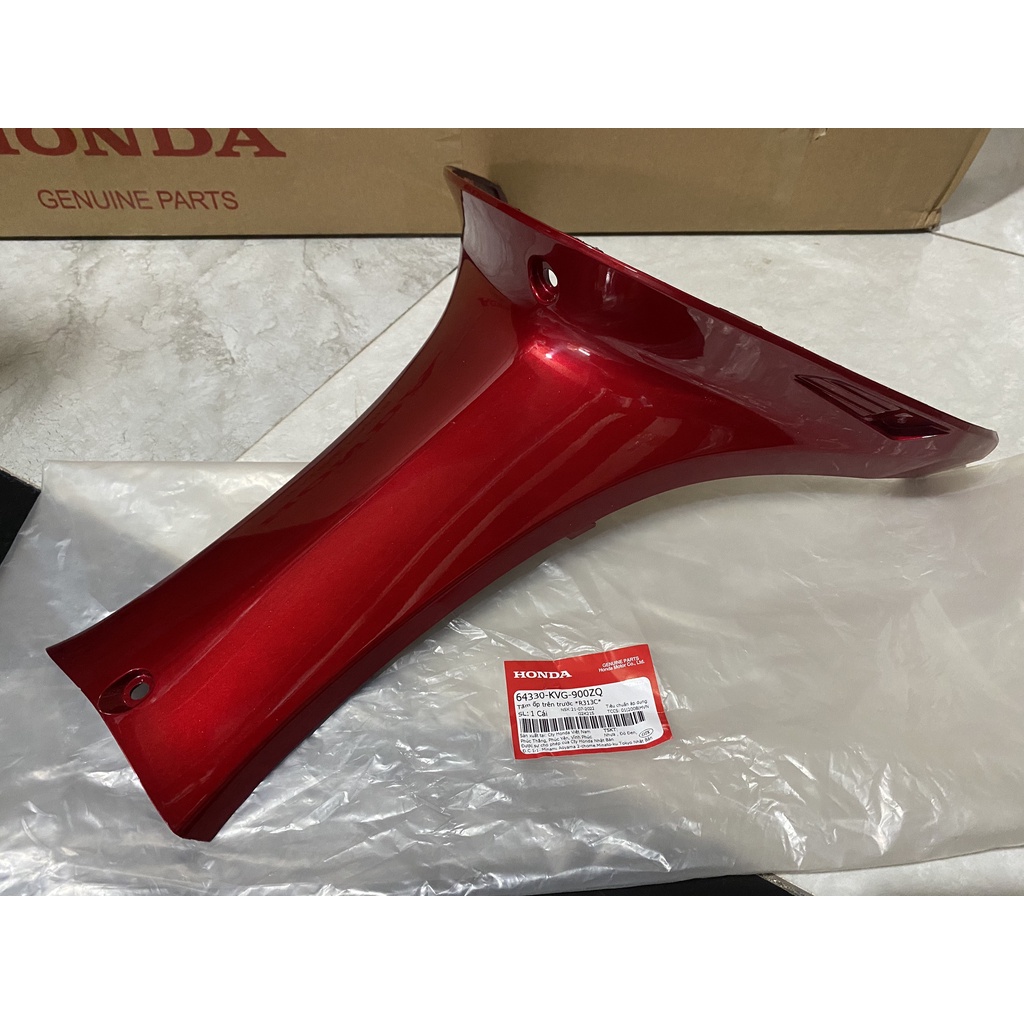 Tấm ốp trên trước - Ốp dưới ổ khóa HONDA AIR BLADE 110 năm 2007 màu Đỏ.
