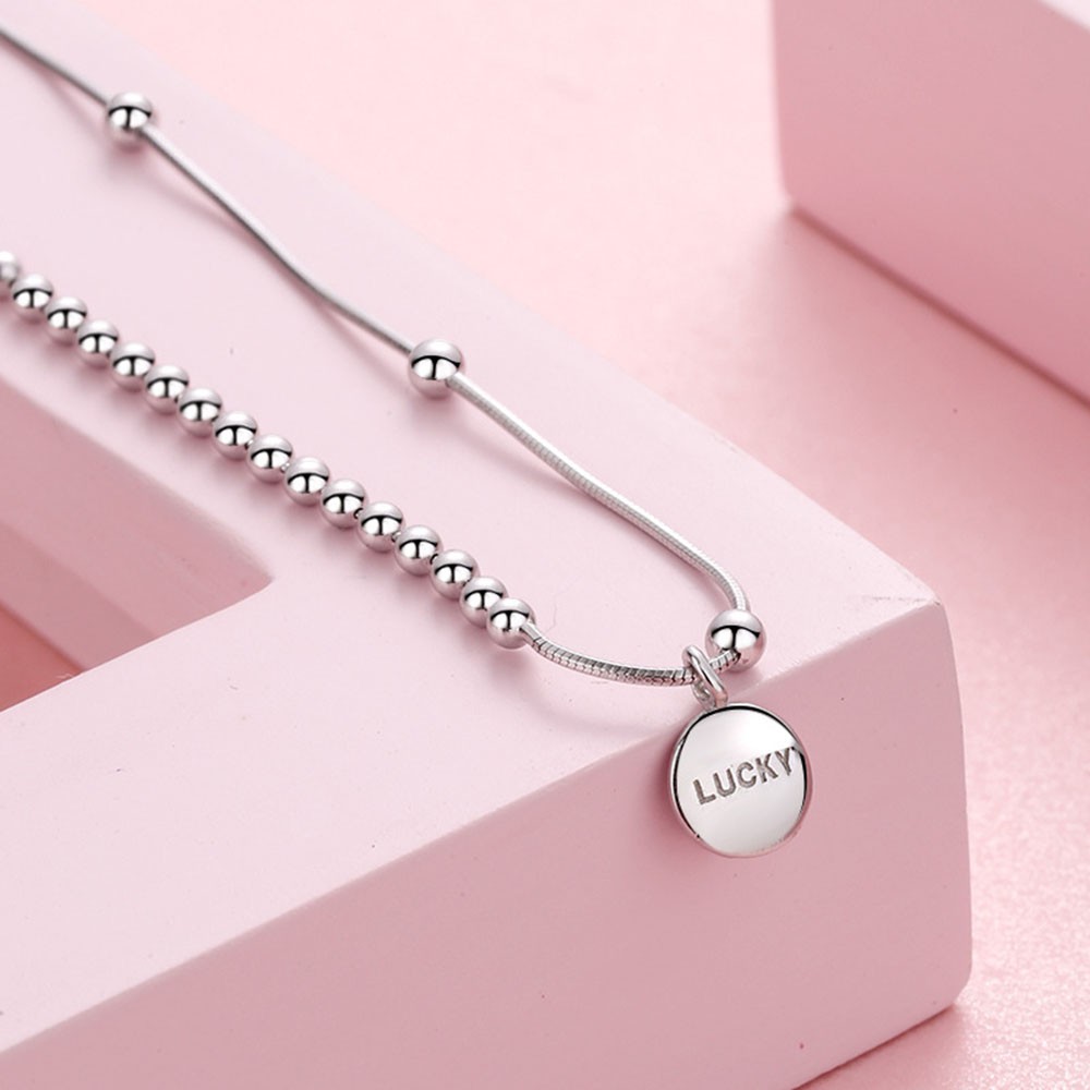Vòng tay chuỗi hạt mặt kim loại khắc chữ Lucky dành cho nữ