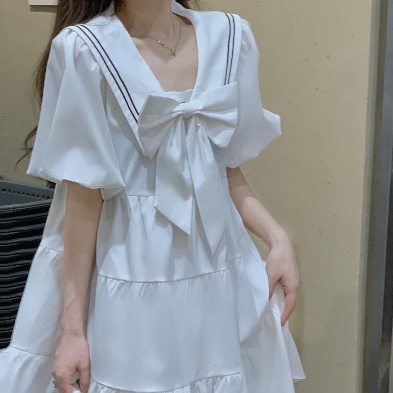 Váy babydoll trắng phối nơ nhẹ nhàng