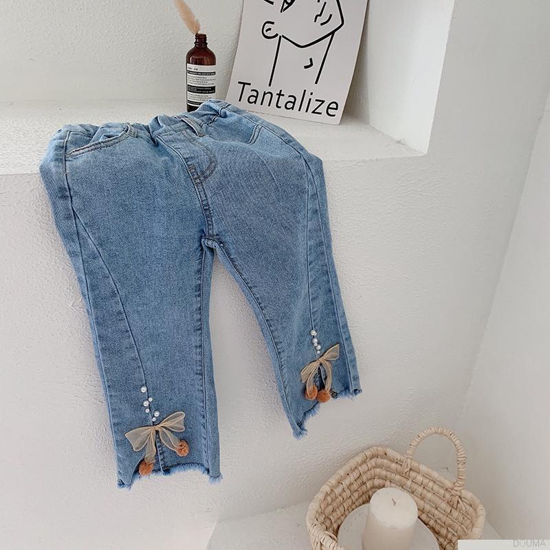 Quần jeans ống loe đính nơ thời trang cho bé gái