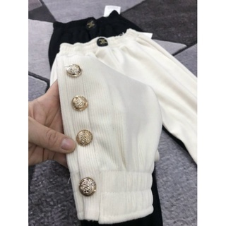 Quần nhung bom cúc đính gấu