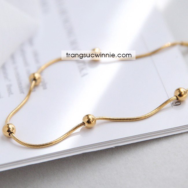 Lắc chân nữ titan bi vàng gold