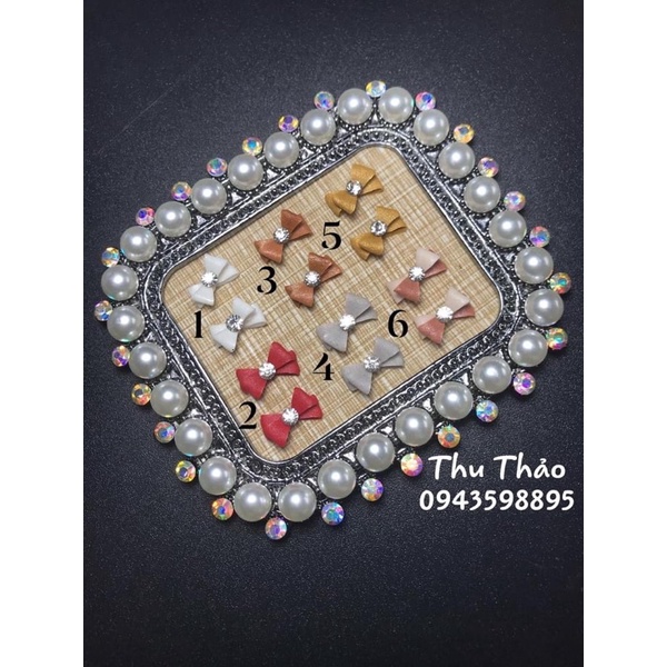 Nơ bột gắn móng tay (1 cái)
