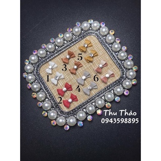 Nơ bột gắn móng tay