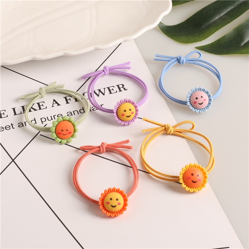 Dây buộc tóc hoa mặt cười xinh xắn  Clovershop68