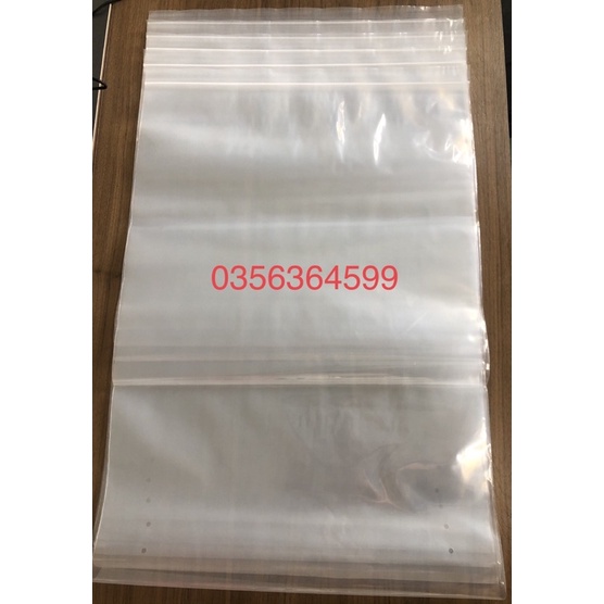 1 chiếc túi zip size lớn có bấm lỗ, đựng quần áo, chăn màn 40x60cm