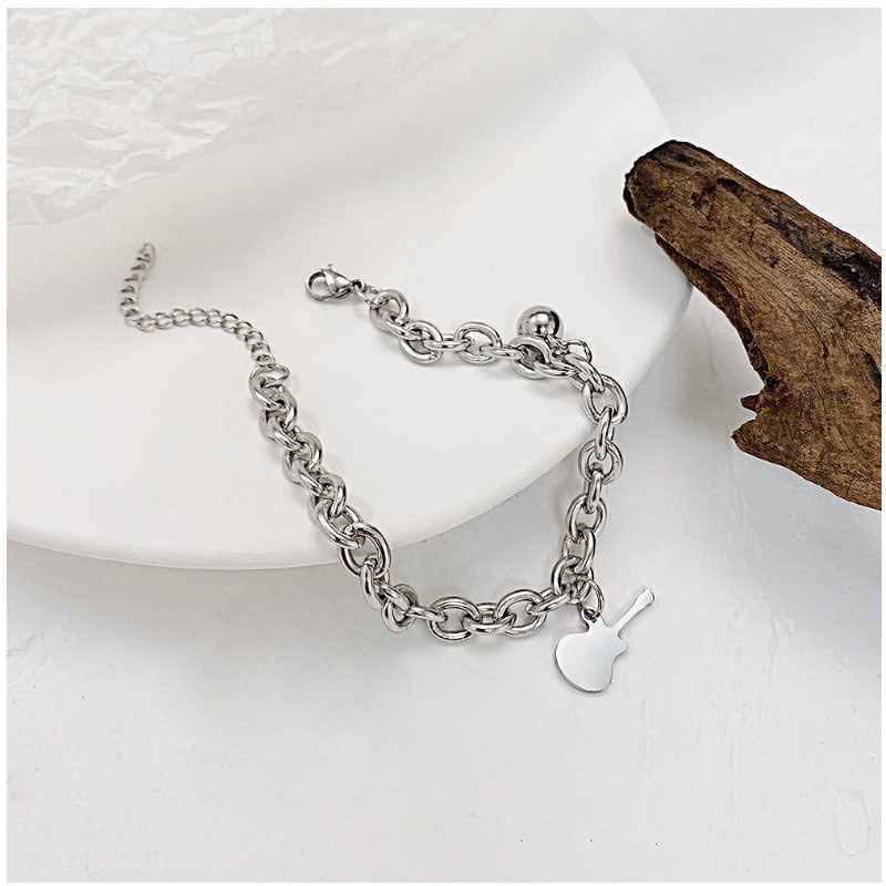 Lắc Tay Nữ Titan Ko Đen Kiểu Dây Xích Cây Đàn Và Trái Châu TT 4067