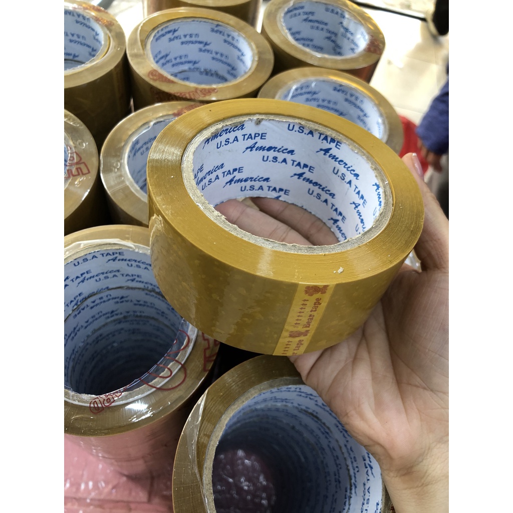 Băng keo vàng đục 4,8cm-200yard lõi 3.5li để đóng hàng 1,2kg 6 cuộn giá sỉ