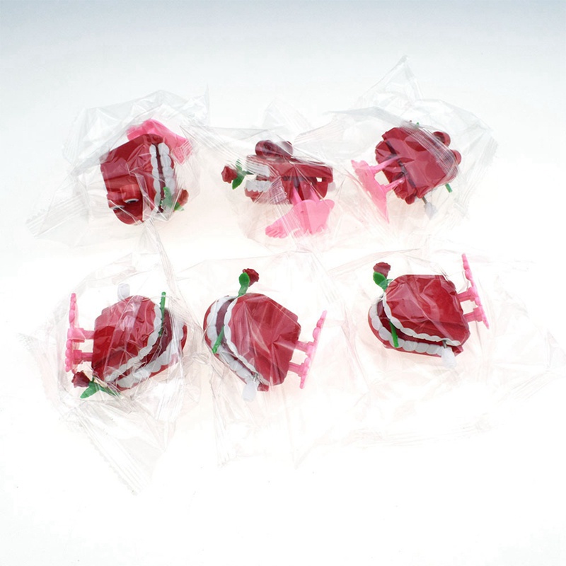 Đồ chơi lên dây cót hình hàm răng dễ thương cho bé