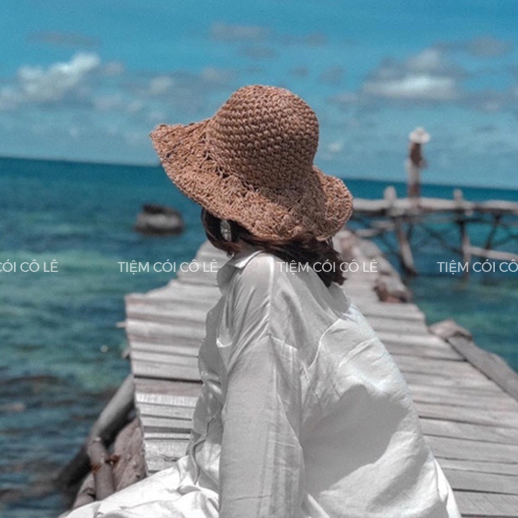 Nón cói đi biển thắt nơ vành đan hoa thưa, mũ cói vành rộng đi biển - Tiệm Cói Cô Lê