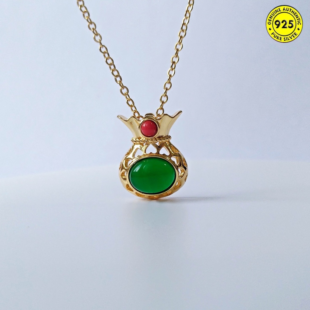 Dây chuyền may mắn hình túi xách đính ngọc lục bảo