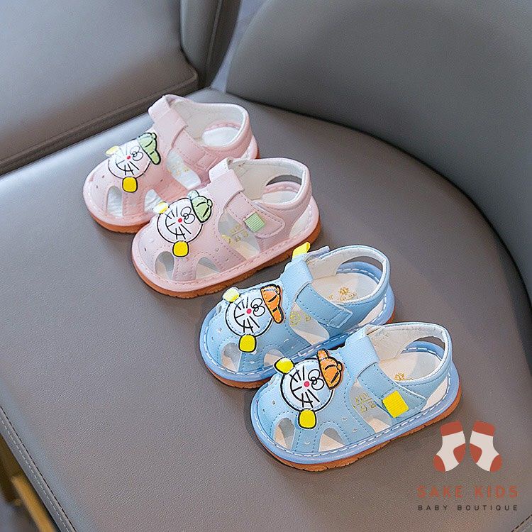 Sandal tập đi bé trai bé gái - Dép rọ có còi hình Đoremon dễ thương chống trơn trượt cho bé từ 0-1 tuổi M301
