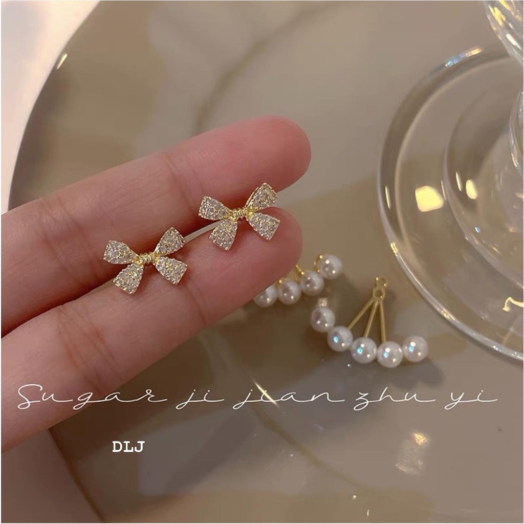 BÔNG TAI NƠ BẠC GẮN NGỌC TRAI GIẢ