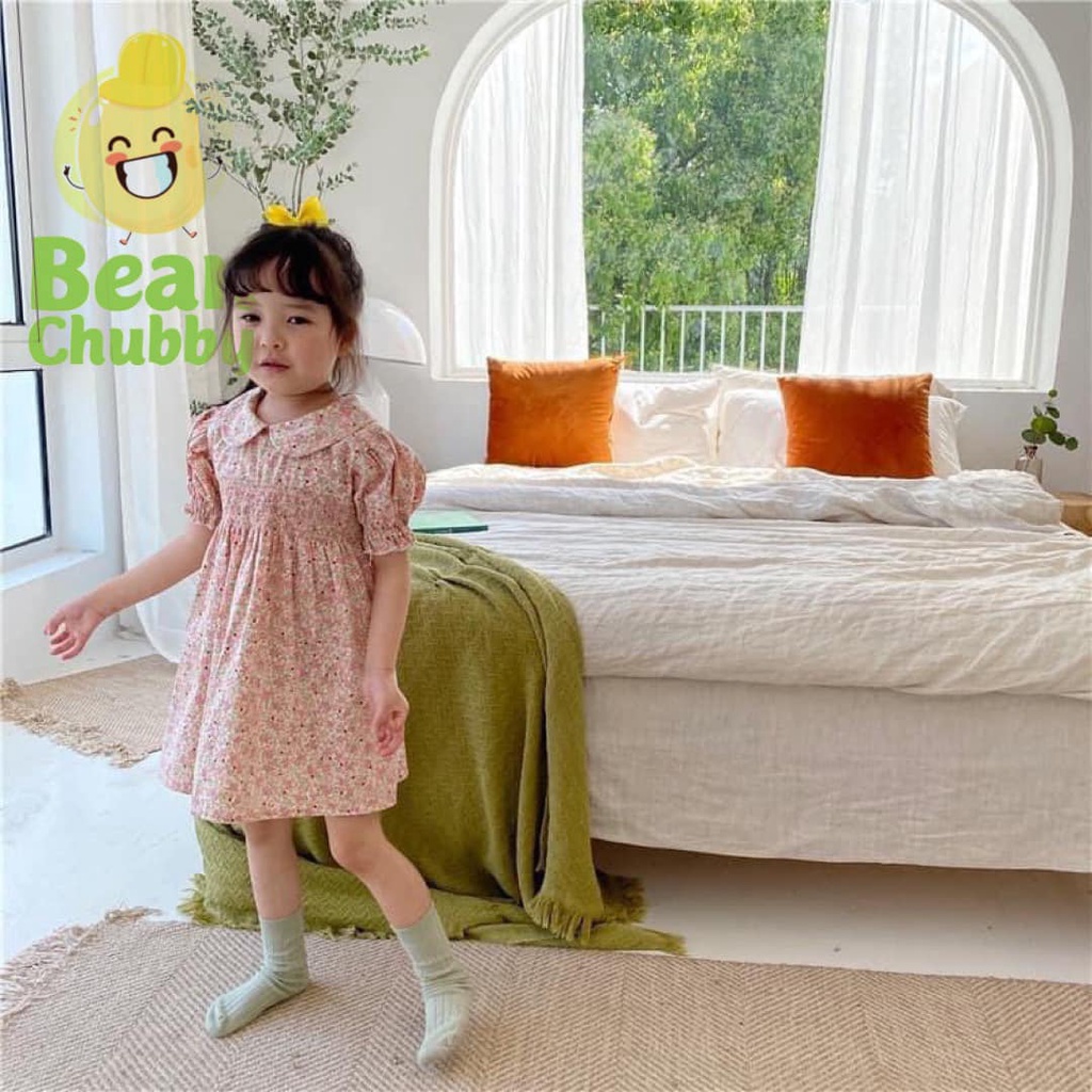 Đầm smock ngực hoa nhí cổ sen bé gái