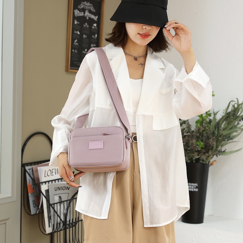 Ba Lô Vải Nylon Màu Sắc Macaron Thiết Kế Đơn Giản Sức Chứa Lớn Cho Nữ