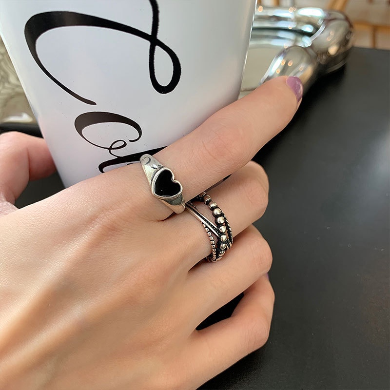 Set 7 nhẫn AY trang trí trái tim chữ thập màu đen thời trang dành cho nữ