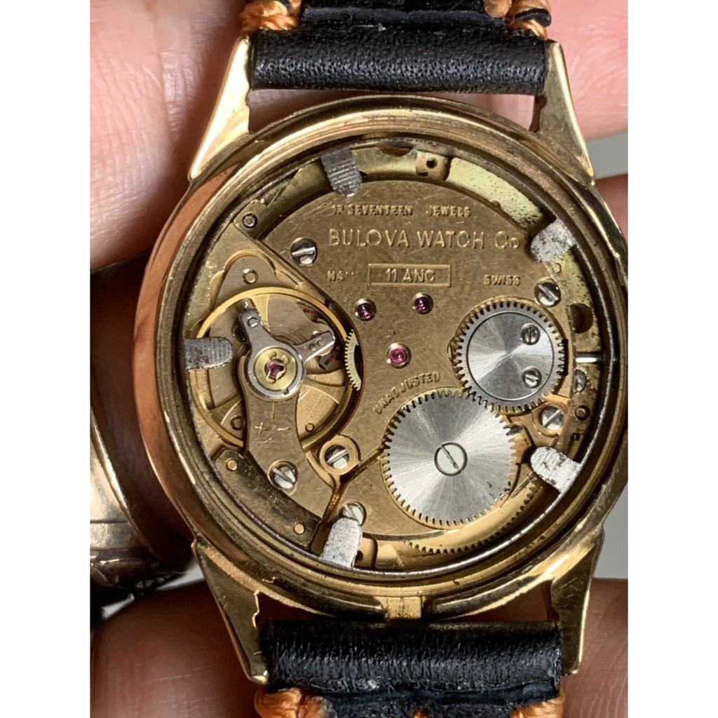 Đồng hồ nữ BULOVA cơ lên cót tay, máy vàng, mặt màu trà, niềng lắc kê vàng, dây da