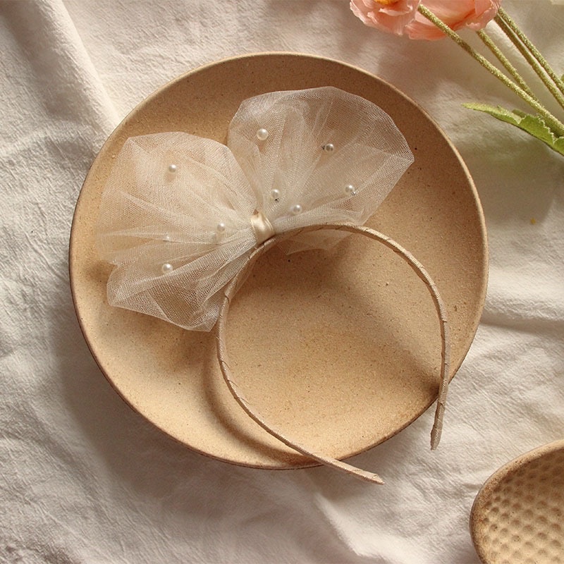 Bờm nơ to đính trai cho bé gái