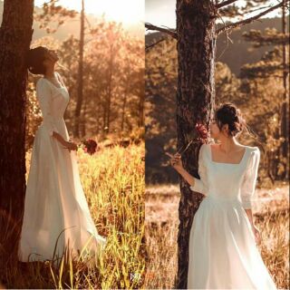 Đầm trắng tay dài cổ vuông