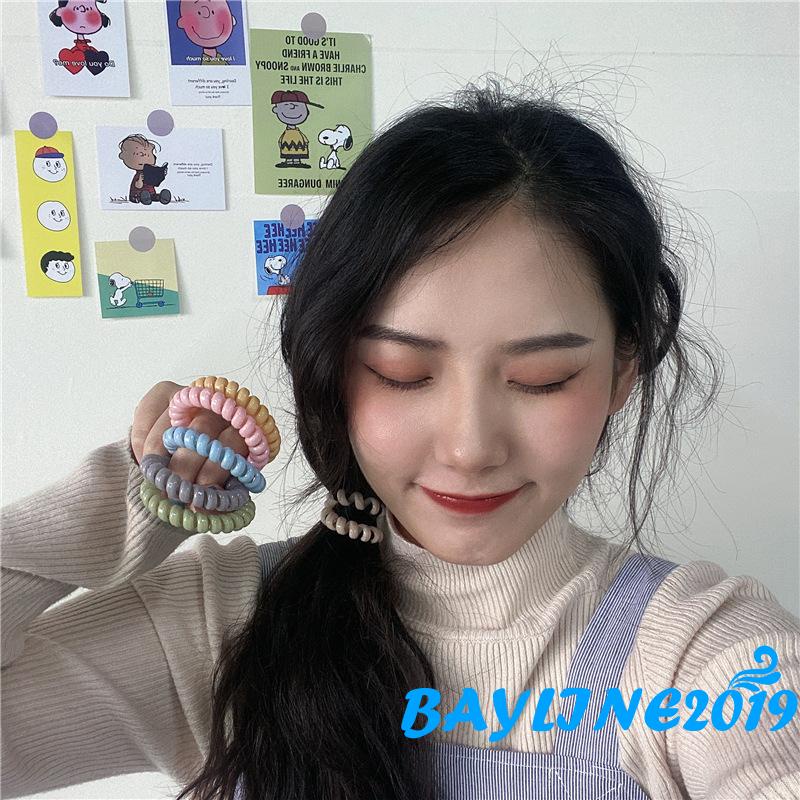 Dây buộc tóc co giãn màu trơn xoắn ốc không để lại dấu vết cho nữ